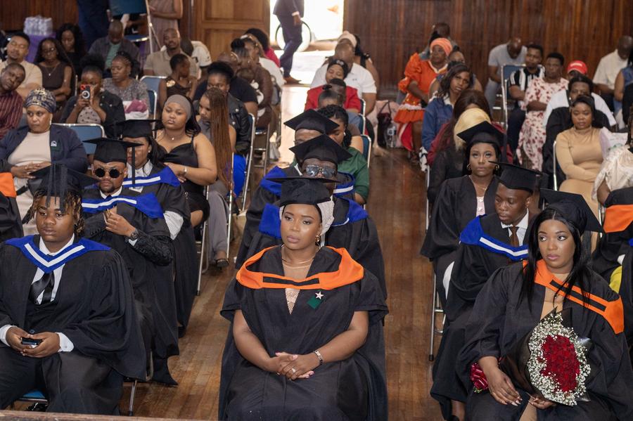 Graduates and families seated at the graduation ceremony